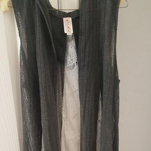 Sheer sweater vest.